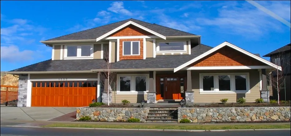 Two-storey craftsman home with stone base and covered entry